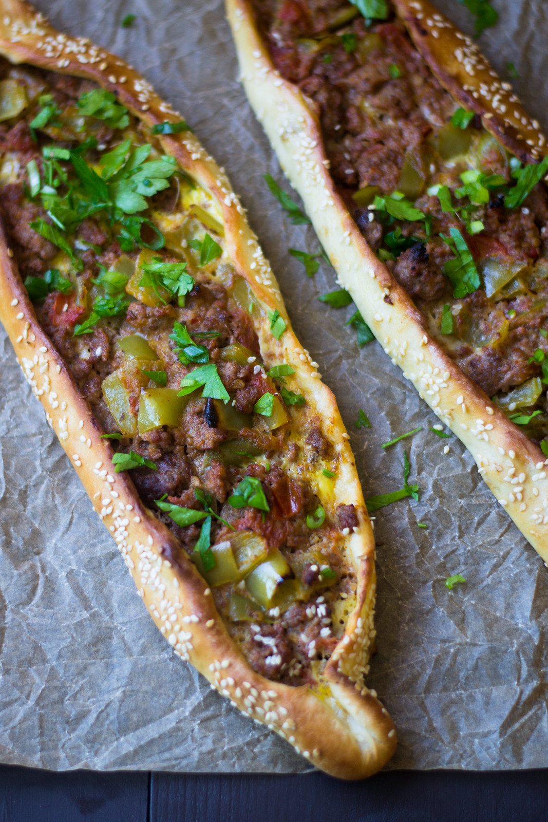 Turkish Pide (aka pizza) is a Turkish comfort food favorite! Here are 2 different fillings, one with meat and peppers and the other with cheese and egg.