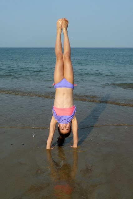 Dova handstand on beach