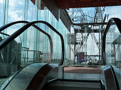 Large glass walls of the MAS - Museum aan de Stroom - with a view over the city-center of Antwerp and the old cranes, collected on the border of river Schelde - photography of modern architecture in the urban city - Fons Heijnsbroek, Antwerp 2012