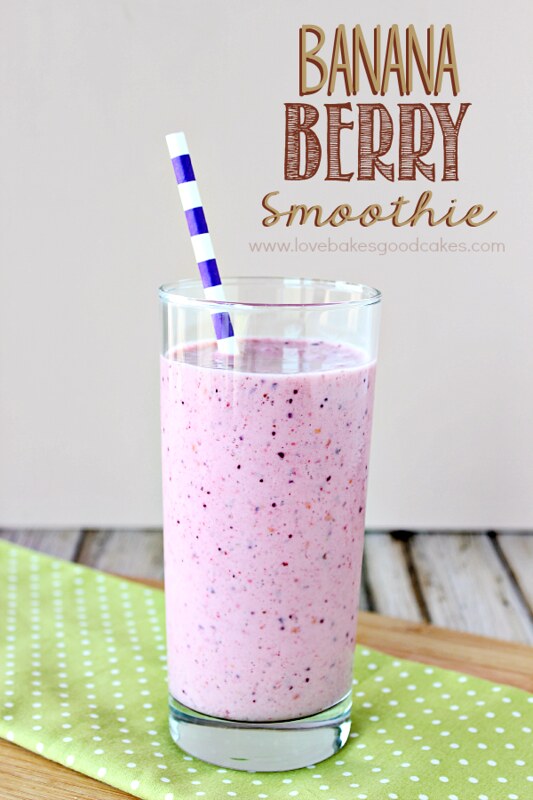 Banana Berry Smoothie in a glass with a straw.