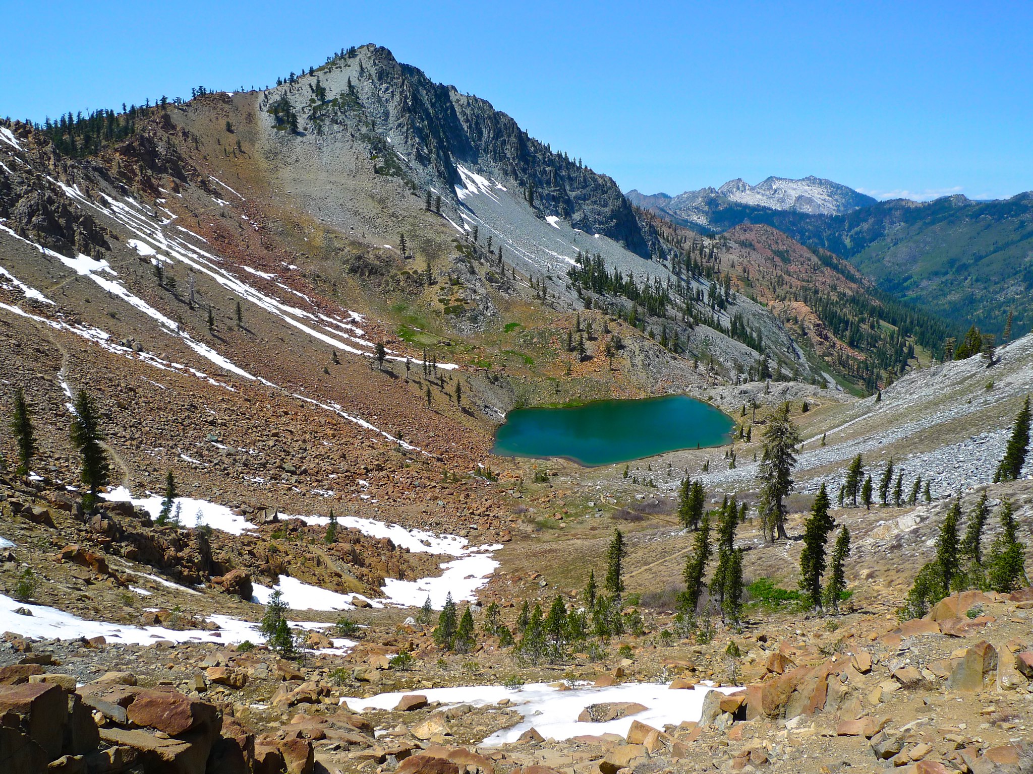 The views are great atop Deer Pass. Siligo Peak and Deer Lake in the foregrund and the White Trinities in the background.