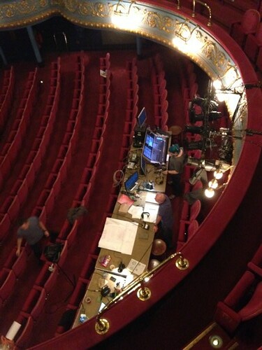 View from upper circle of tech desk which they use to control sound, lights, projections etc during tech week. Photo © Jo Rush