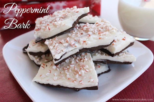 Peppermint Bark on a white plate with a glass of milk.