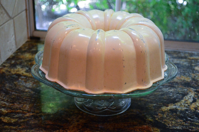 The serving platter has been flipped and now the Bundt pan is on top.