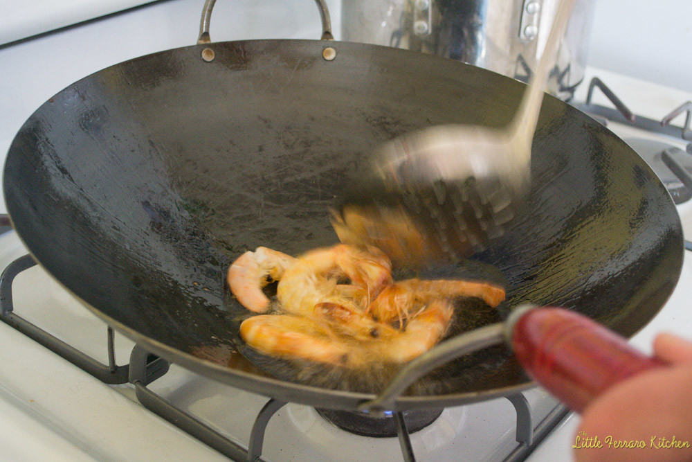 First heat the wok to very hot and cook the head on shrimp for shrimp chow mein.