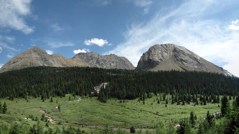 Panorama with distant waterfall, center, and Tilted Mountain on the right, from the Baker Creek Trail
