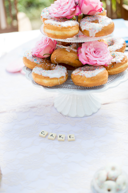 donut cake with scrabble letters in front