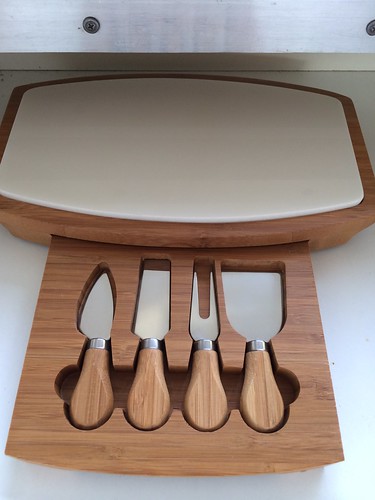 A cheese board with built in cutlery. Alas, it won't help me cut through the ethical problems with so many cheeses.