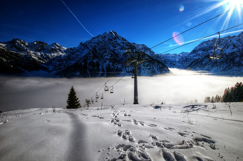winter sun mist mountain snow ski fog chair lift hiking footprints hdr kleinwalsertal