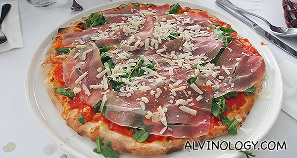 Wood-fired pizza with parma ham and wild rocket 