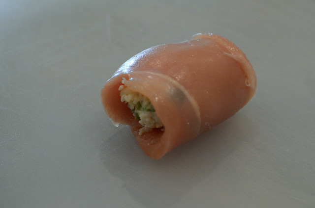 The chicken breast is rolled up to enclose the broccoli cheese mixture.