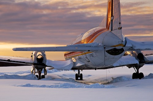 winter sunset snow ontario canada tarmac rural airplane airport tail elevator storage apron repair landinggear service parked salvage runway airliner turboprop rudder spareparts grounded northernontario fuselage sidelight airinuit areodrome hawkersiddeleyhs748 lairdtownship avro748 cfget barriver combiaircraft gnd2s