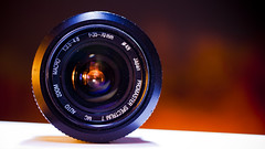 Photo of a camera lens.  Source: https://www.flickr.com/photos/52389679@N06/12245460095