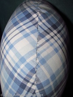 The neck pillow opening, stitched closed.