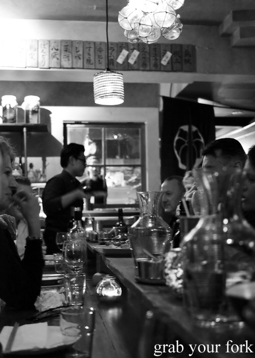 Diners at the communal table at Chaco Bar, Darlinghurst