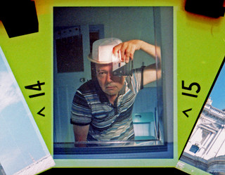 reflected self-portrai with Hanimex Disc 120 camera and compound hat
