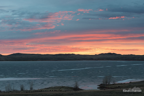 march spring nikond750 tamron2470mmf28 lakedesmet sunrise early morning color colorful clouds sky orange pink red water frozen ice icy hills gold golden wyoming trees