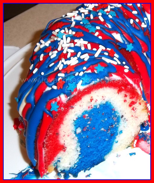 Firecracker Bundt Cake with a slice removed to show the inside. Red White and Blue {Recipes and Crafts} shared at Freedom Fridays.