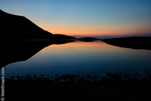 blue brecon breconnationalpark lake llynyfanfawr mountains nationalpark red rock sunset wales water dusk remote wilderness