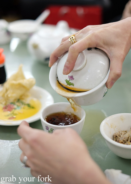 Pouring tea at Lin Heung Tea House in Central, Hong Kong