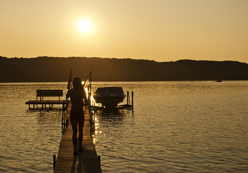 sunset lake girl boat dock limelake puremichigan