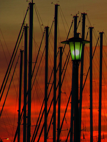 abstract bright sunset clouds light mast orange sky ship volos seaside magnesia thessaly greece