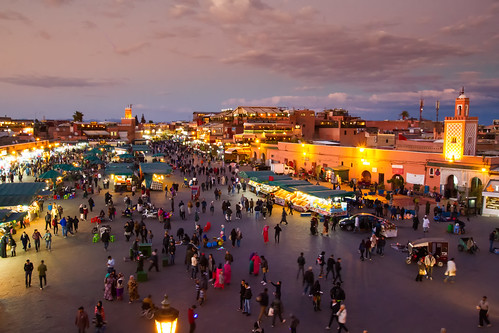 red maroc marrakesh morocco night city architecture people tourism tourists mosque stalls squaue square traders food juice spices shops lights sky sunset dark clouds
