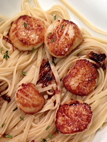 Scallops with thyme butter sauce served over linguine
