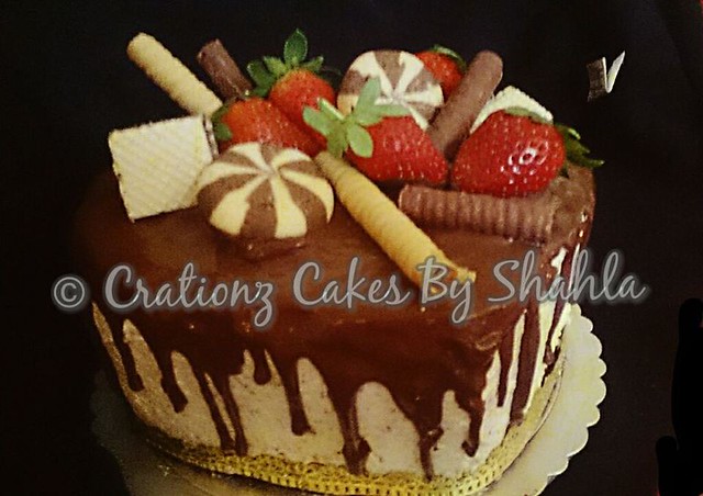 Naked Dripping Chocolate Cake with Assorted Chocolates from Creationz Themed Cakes by Shahla