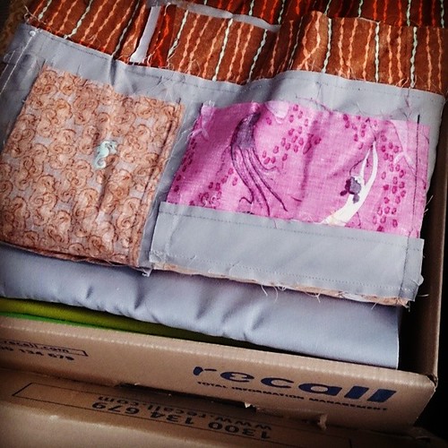 The packing has begun! This is the box of Heather Ross and Kona yardage...
