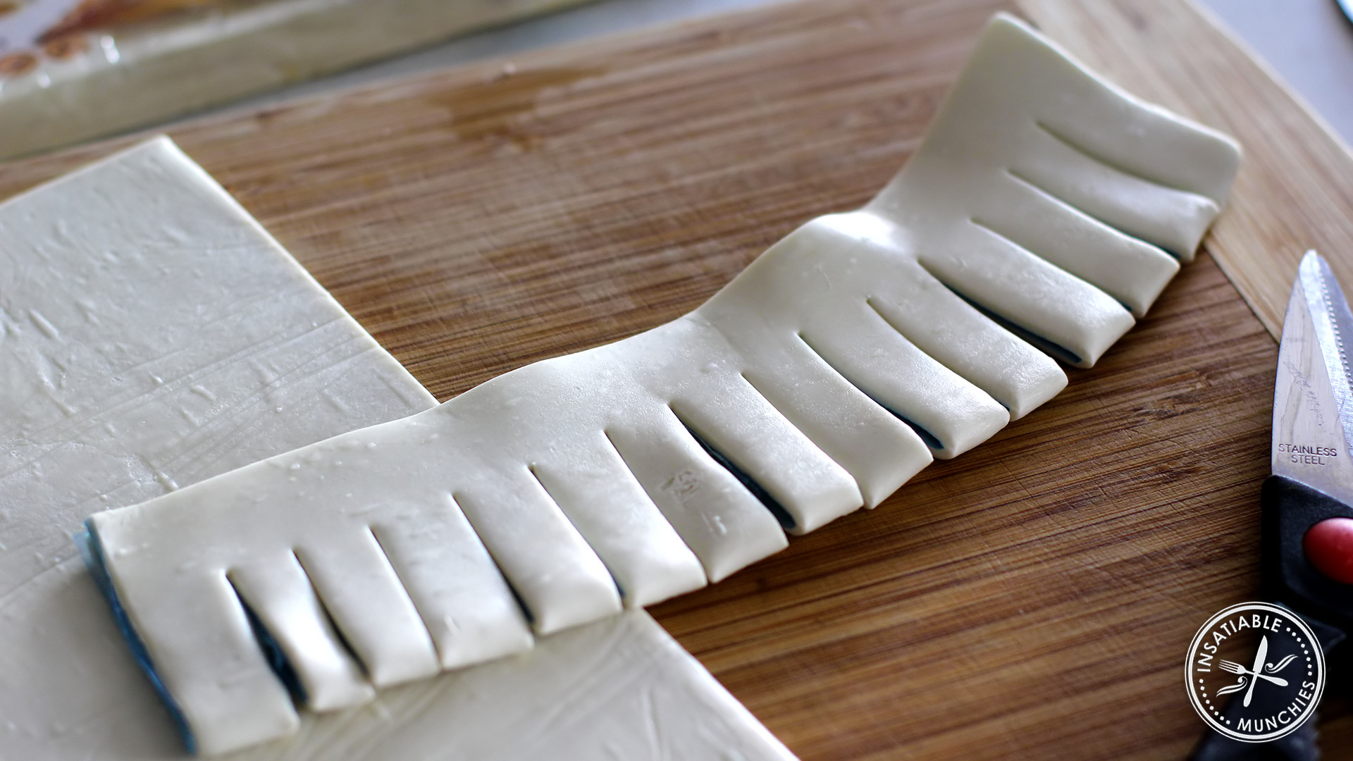 Using scissors, make cuts into the folded side of the pastry. 