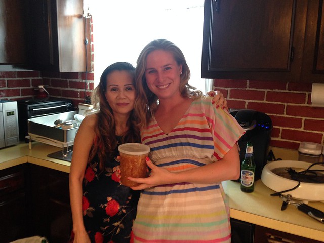 Mom and I holding the finished product of ginger dipping sauce.