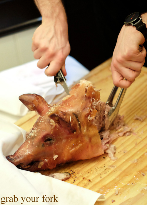 Carving the suckling pig head at the Four in Hand, Paddington
