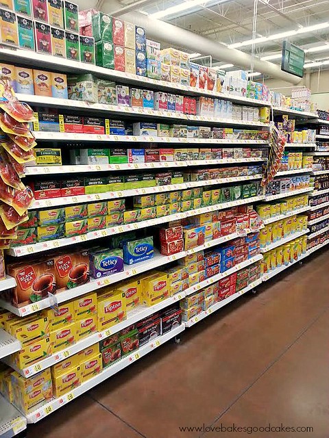 A grocery store isle with Lipton Ice Tea products on the shelf.