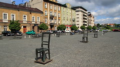 The symbolical idea is a representation of all the old furniture being thrown out onto the so-called Umschlagplatz, when the inhabitants of the ghetto had finally been assembled by the German SS in so-called Aktionen to be sent to death