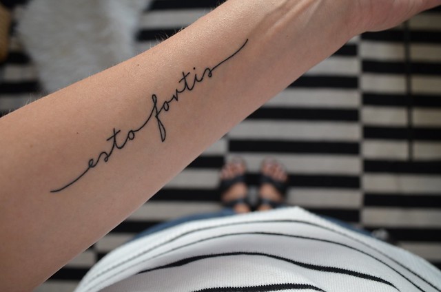 esto fortis latin script forearm tattoo_ black and white background