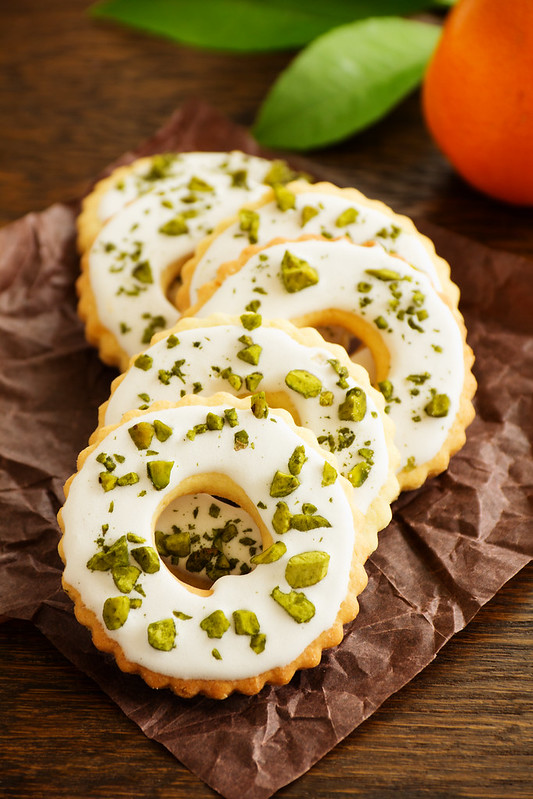 Lemon cookies with frosting and pistachios.
