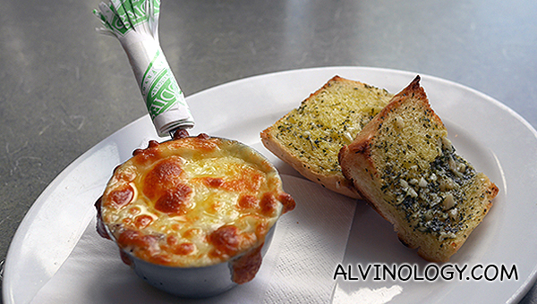 Julienne - cheese mixed with sour cream and mushroom, served with bread 