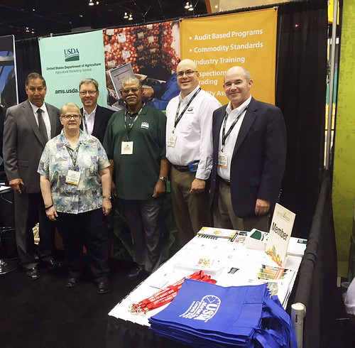 A team of AMS employees staffing a booth at the United Fresh Convention and Expo