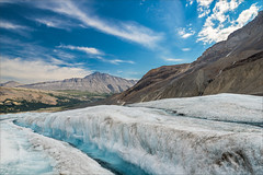 A glacier is a large mass of slow moving ice.