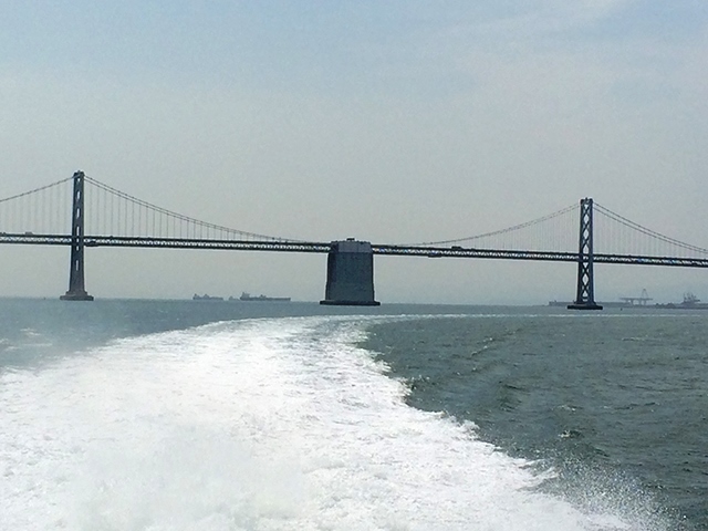 bridge & boat wake, urban ocean horizon