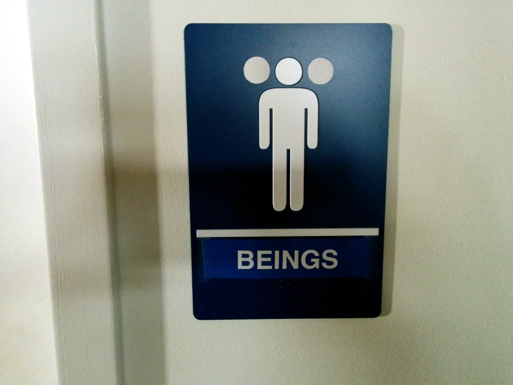 a bathroom sign that just says "beings"