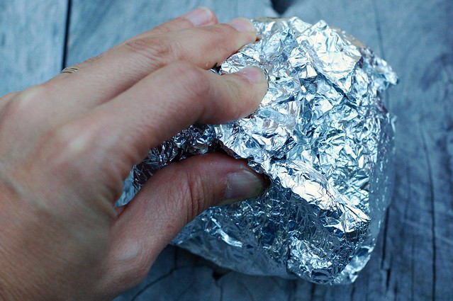 Wrapping up the Herb Buttered Potato in Tin Foil by Eve Fox, The Garden of Eating, copyright 2014