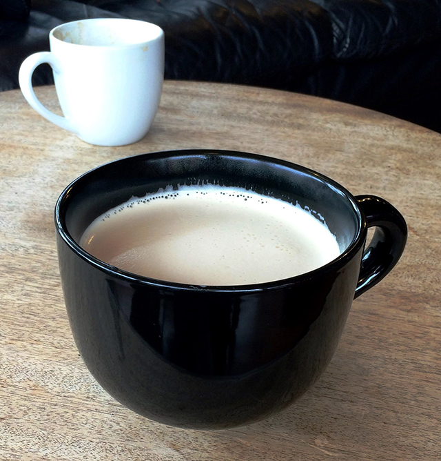 chai latte in a giant black mug