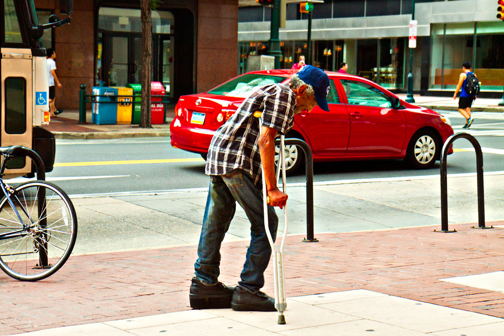 Man-with-crutches-on-9-6-14--Center-City