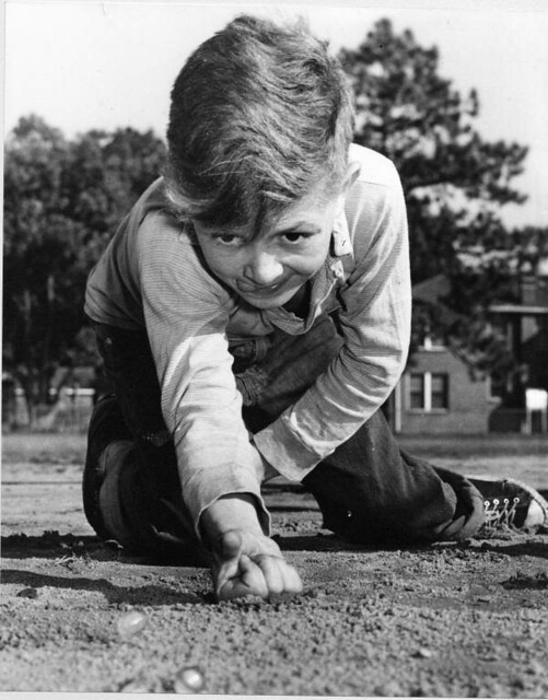 Young boy playing marbles - Jacksonville