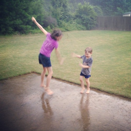 These 2 goofballs are dancing in the rain!