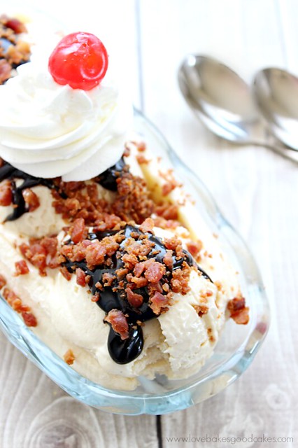 Elvis Banana Split with Homemade Peanut Butter Ice Cream in a dish with a spoon close up.