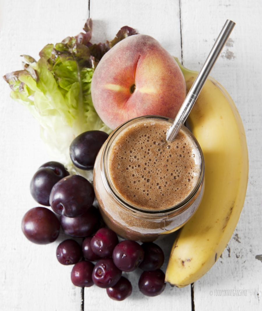 Green smoothie with batiava lettuce,peach,cherries and plums