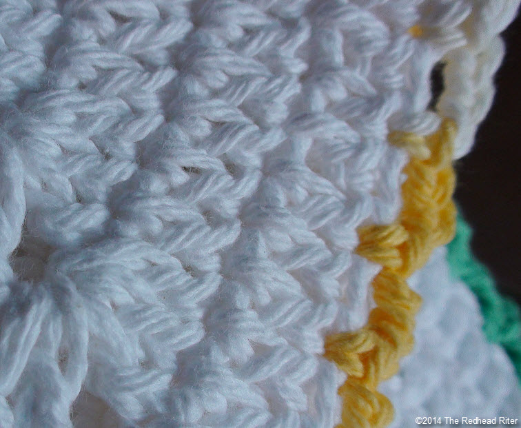 crocheted cotton dishcloth yellow white closeup edges